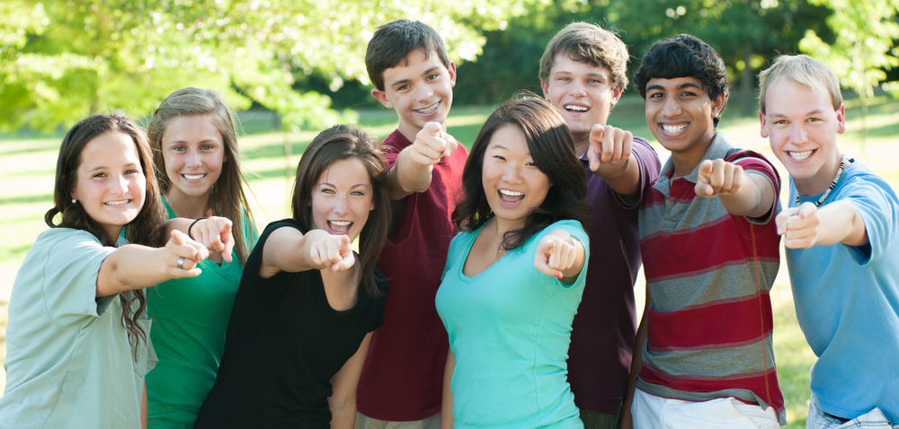 Teenagers pointing