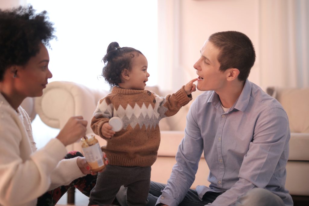 mixed race family with woman, man and child