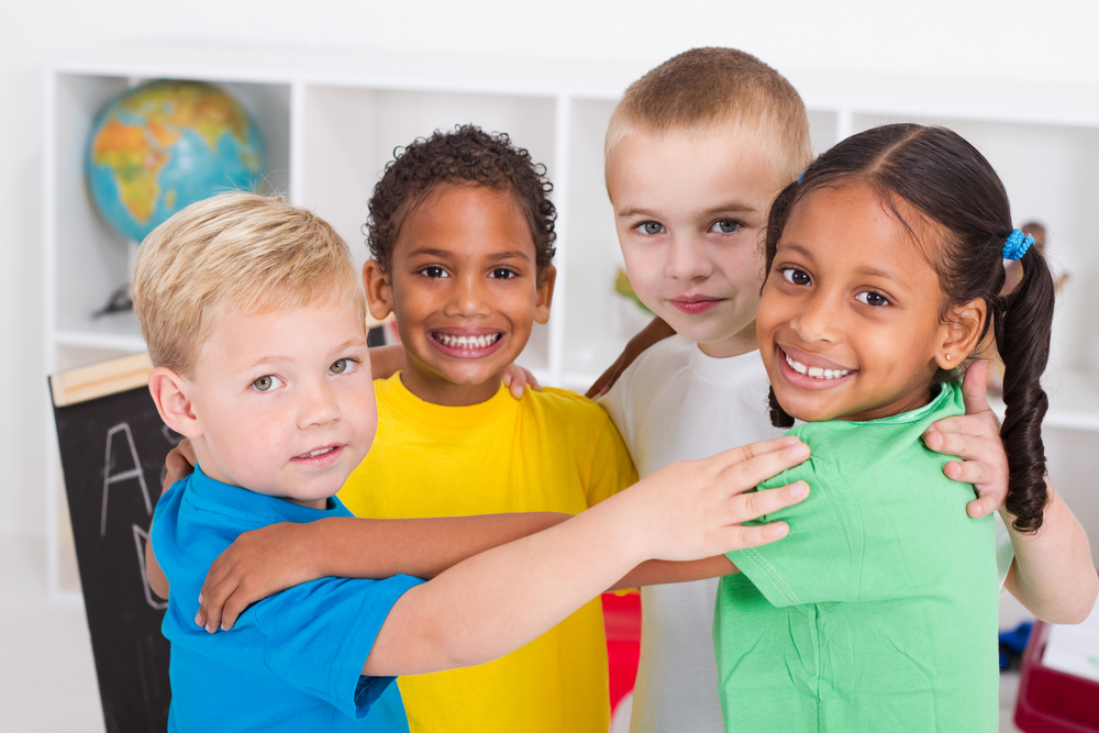 four children embracing